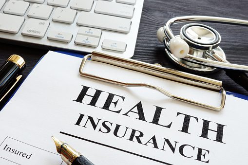 Insurance forms with a stethoscope